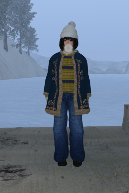 Me in the same outfit and situation as above; the moisture in my breath condenses as I exhale, and my cheeks are rosy from the cold