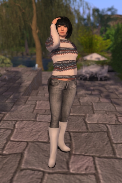 Self-portrait in a grey pair of jeans made from Hyacinth's raw materials, a knit pullover made by a friend of mine and a pair of white boots