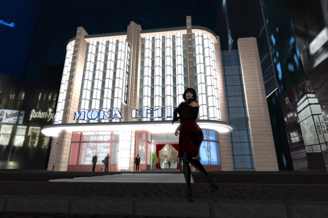 Me in a vaguely late 1920s-style outfit, standing in front of the virtual Moka Efti club. The only other actual avatar in the picture is the club owner who is still dancing inside the club.
