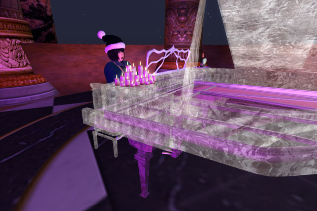 Me singing and playing a transparent grand piano with candles on it