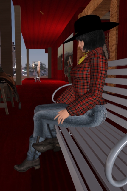 Sitting on a bench outside the event location at Wolf Territories harbour in today's Western outfit