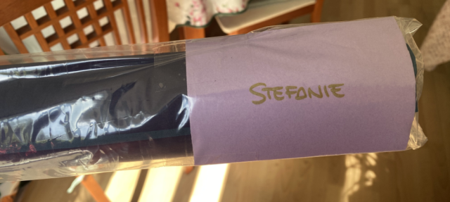 A small envelope at the end of the paper roll, very light purple labelled 'Stefanie' in gold. A small envelope at the end of the paper roll, very light purple labelled 'Stefanie' in gold.