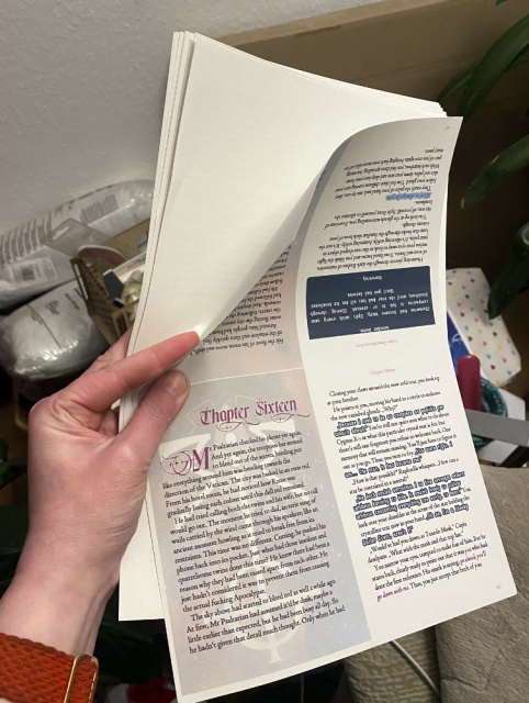 Ten sheets of papers are held up. The top pages has text printed on it, arranged in four blocks, the page behind is blank. Ten sheets of papers are held up. The top pages has text printed on it, arranged in four blocks, the page behind is blank.